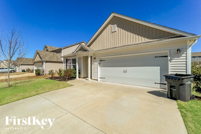 A house with a garage is for sale by FirstKey Homes.