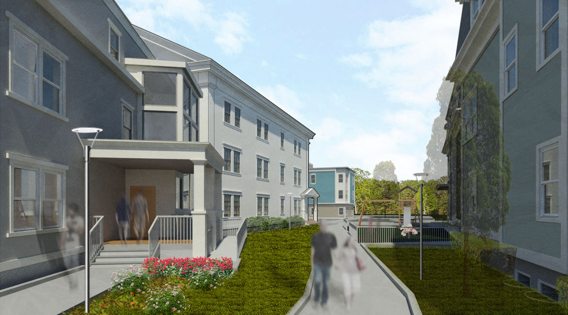 Quiet green space with landscaping, walkway, and tot-lot playground between the two buildings.