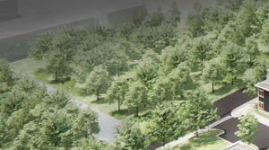 Aerial Aerial view shows buildings with parking surrounded by woods with a small river behind. - Photo Gallery 5