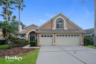 a house with a driveway and a garage door