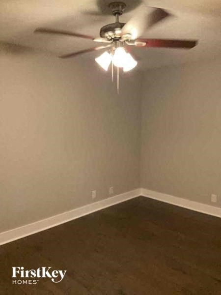 a empty room with a ceiling fan and