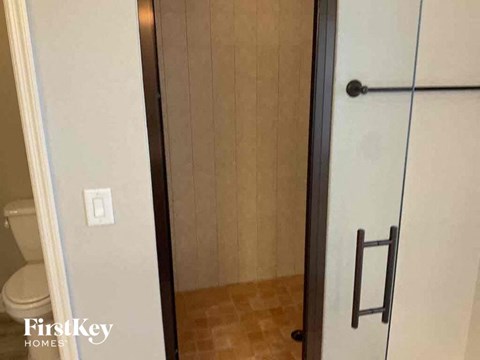 a bathroom with a mirror and a toilet in it