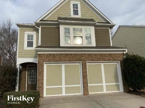 a house with a sidewalk in front of it