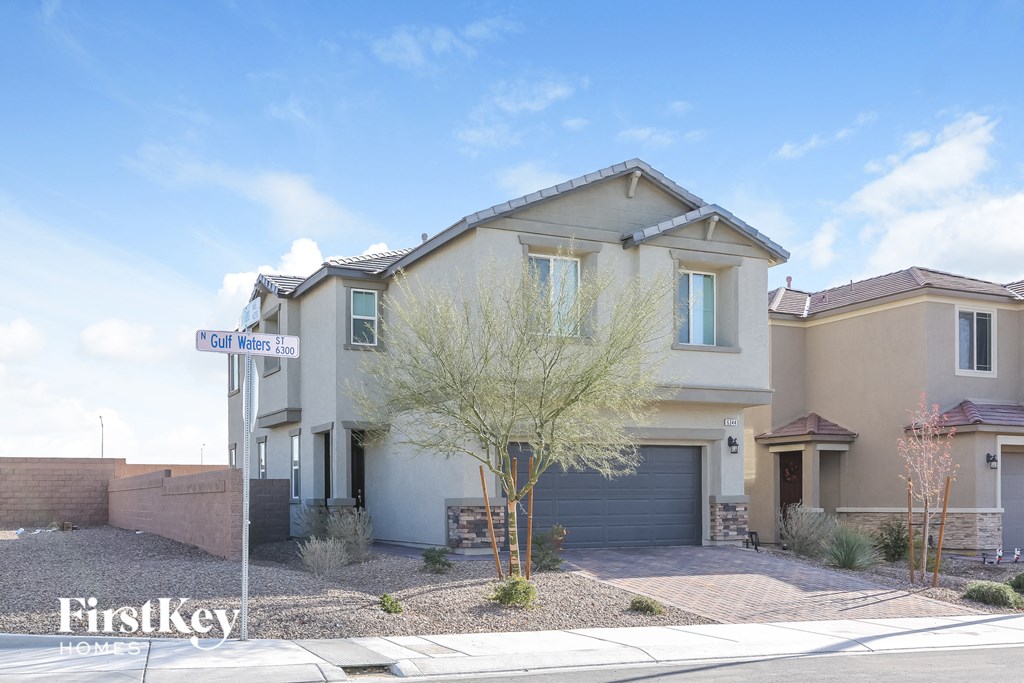 a house with a street sign in front of it