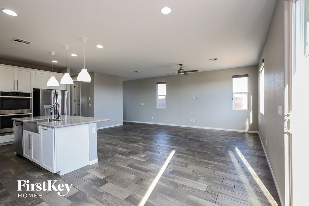 an empty kitchen and living room in a new home