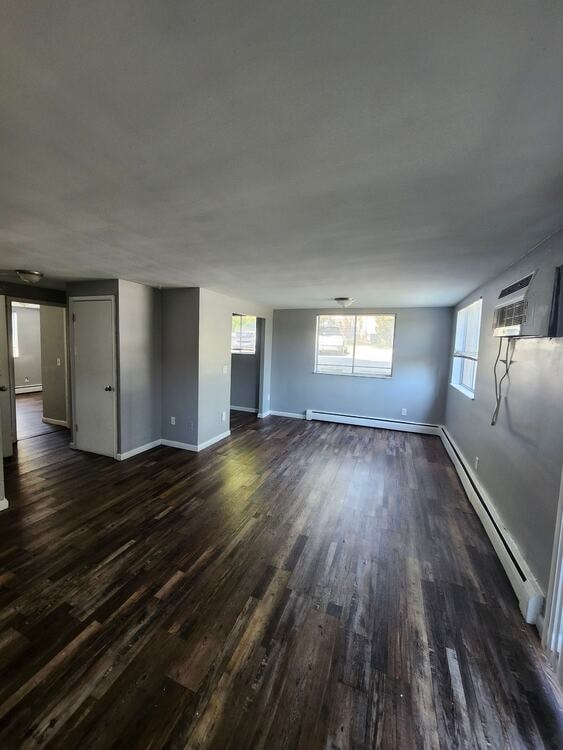 A room with wooden floors and a white ceiling.