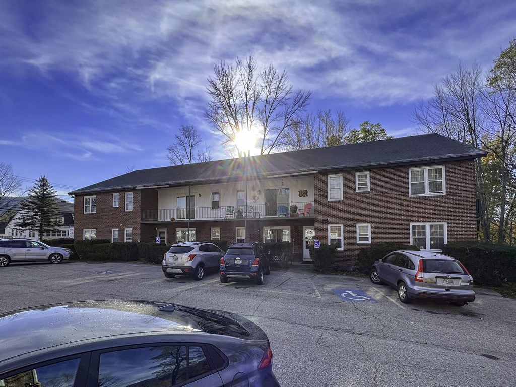 a building with cars parked in front of it