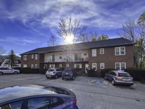 a building with cars parked in front of it