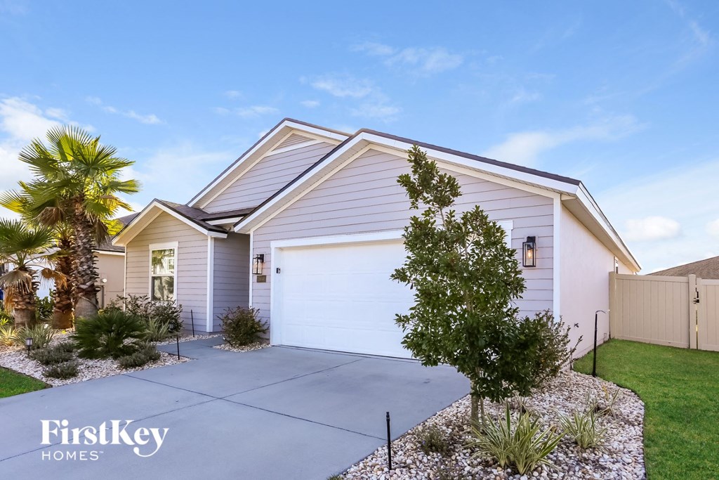a white house with a white garage door