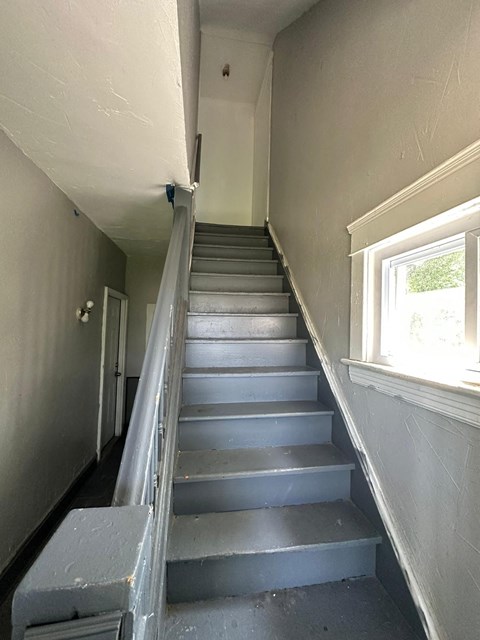 the stairway to the second floor of the house is empty
