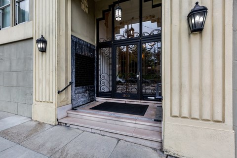 A black wrought iron gate with the number 1900 on it.