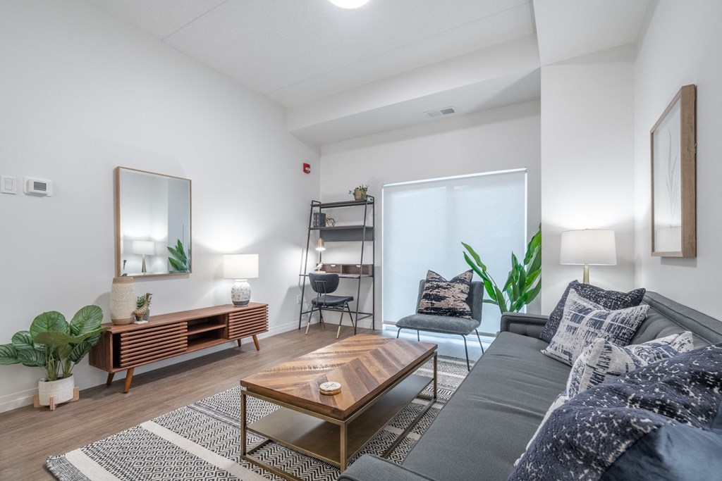 a living room with a gray couch and a coffee table