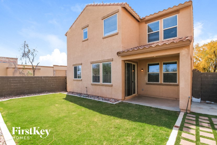 a house with a yard and a patio