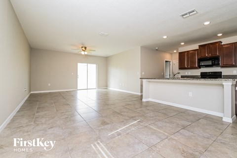the kitchen and living room are spacious and open to the living room