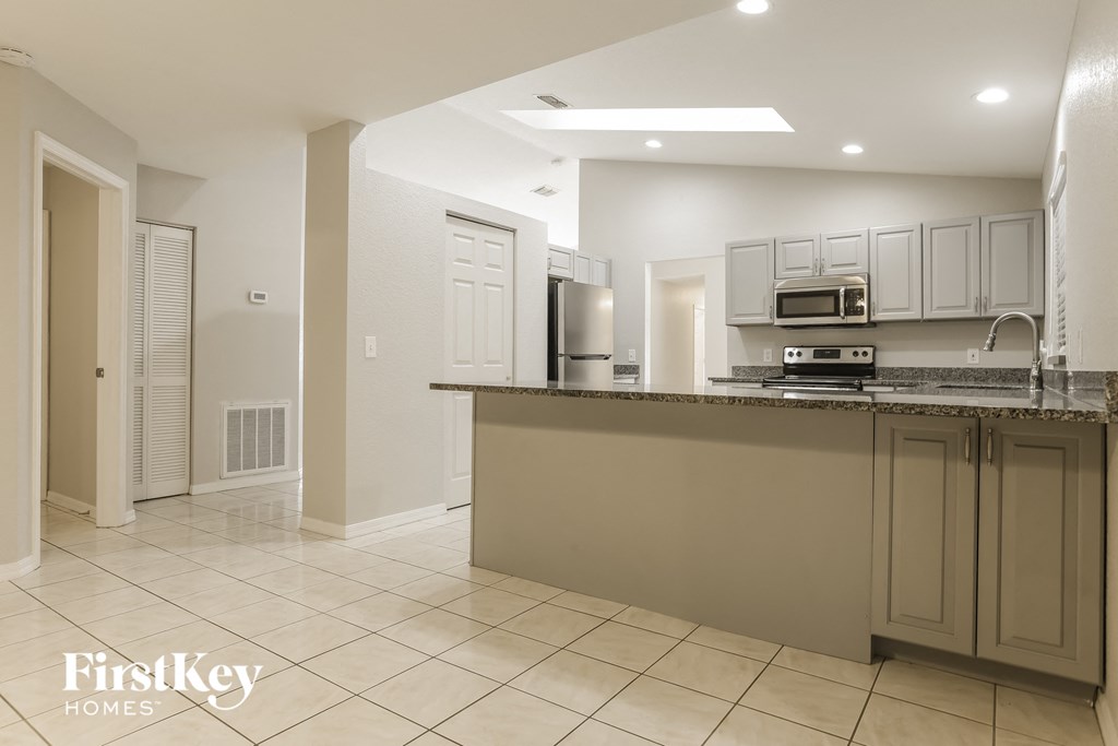 a kitchen with a counter top and a sink