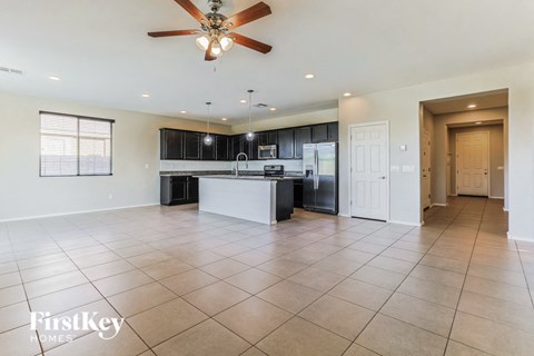 the kitchen is open to the living room and dining room