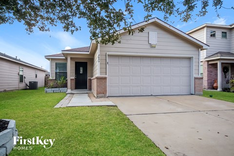 a house with a white garage door and a driveway