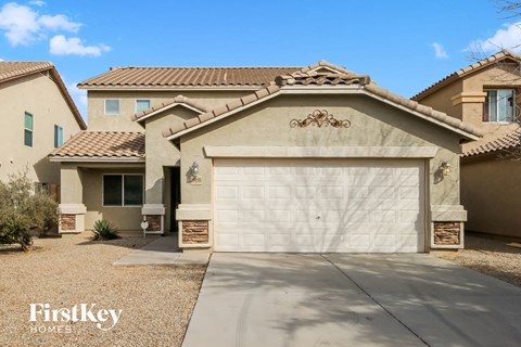 a white garage door in front of a house