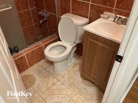 a bathroom with a toilet and a sink