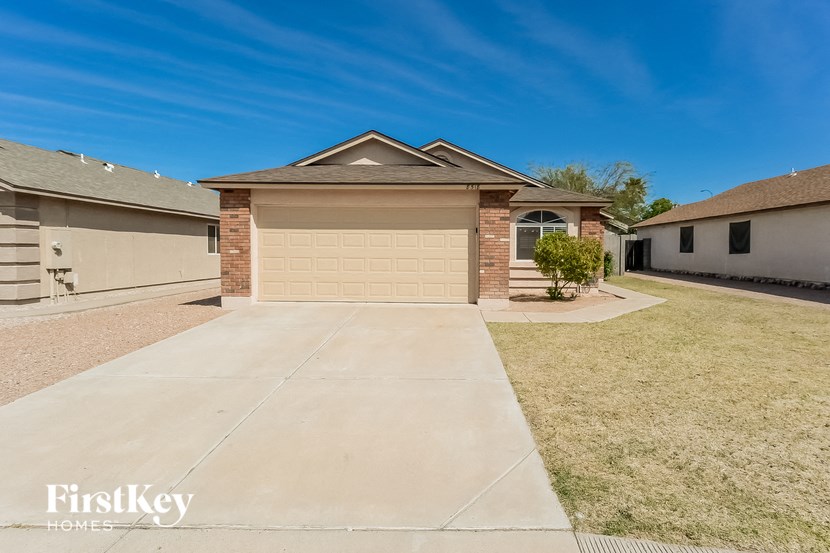a home with a driveway and a garage door