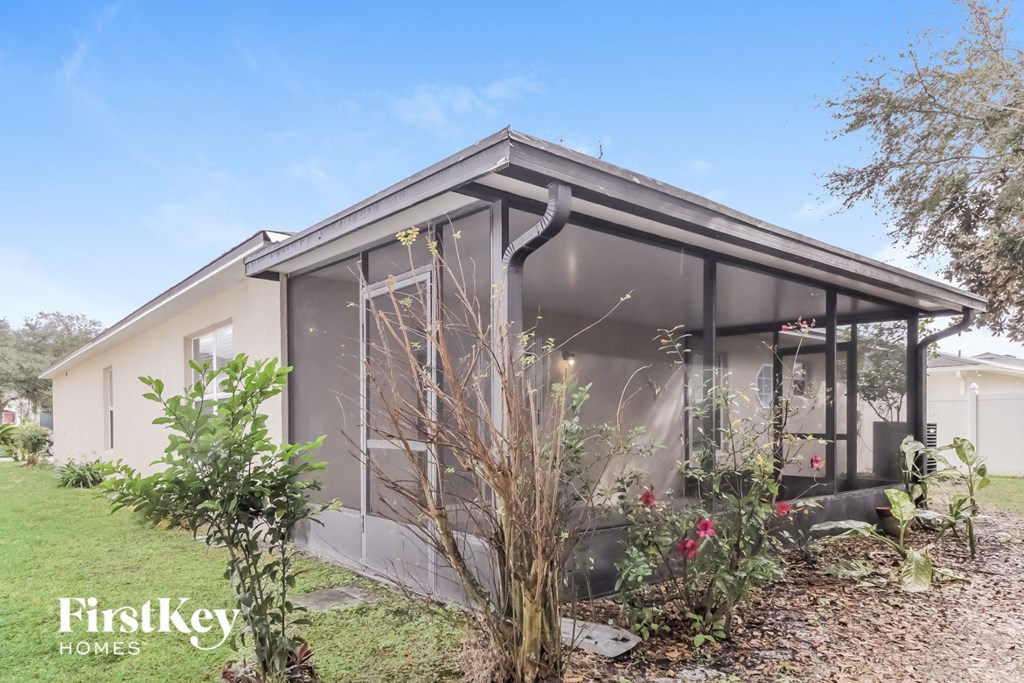 the exterior of a house with a conservatory with plants