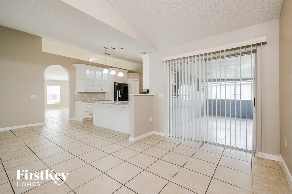 a view of the kitchen and living room from the dining room