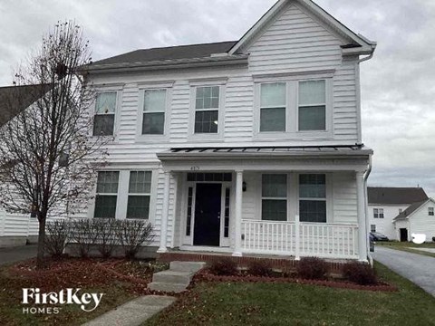 a white house with a front porch and