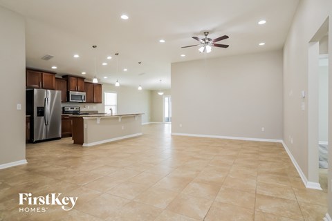 the kitchen and living room are open to the living room and dining room