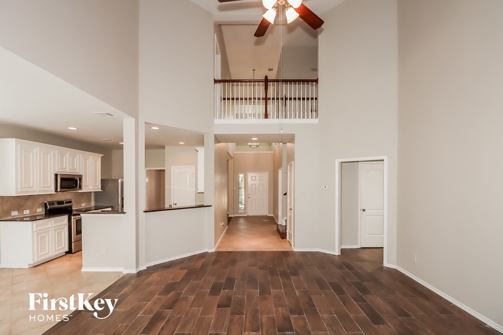 the view of the kitchen and living room from the dining room