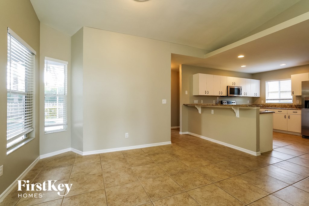 A kitchen area with a counter and cabinets.