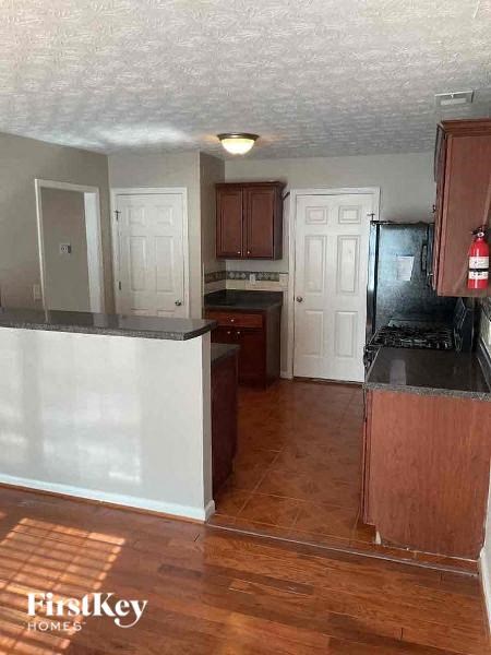 a kitchen with a counter top and a refrigerator