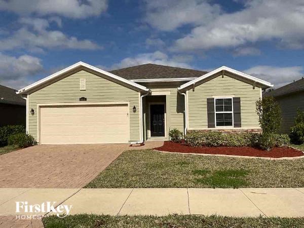 a house with a driveway and a garage door