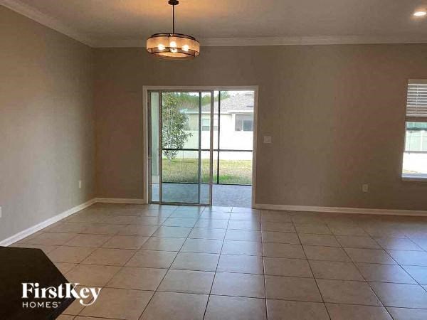 an empty living room with a sliding glass door