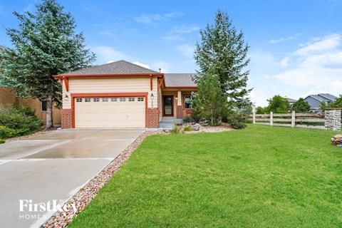 a house with a driveway and a garage door