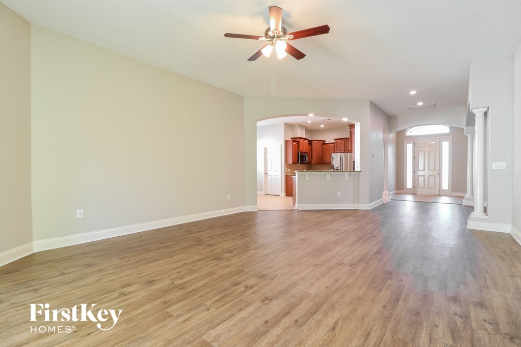 the living room and dining room are open to the kitchen