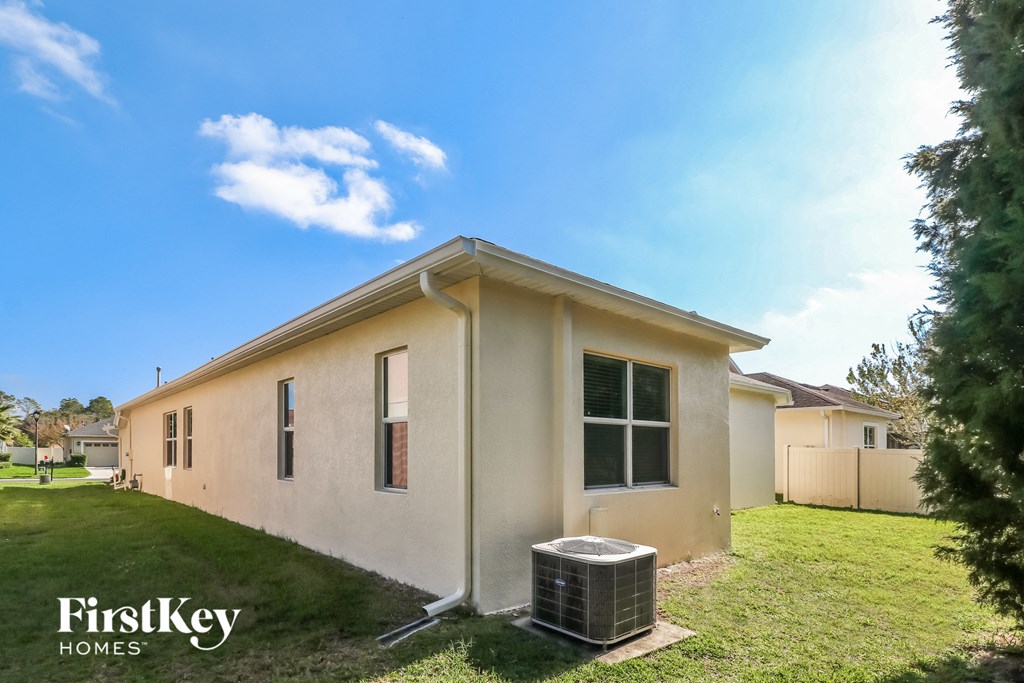 the exterior of a house with a heater in the yard