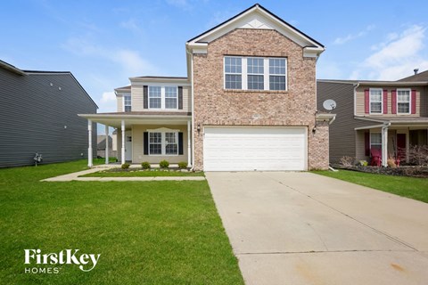 a house with a white garage door in front of it
