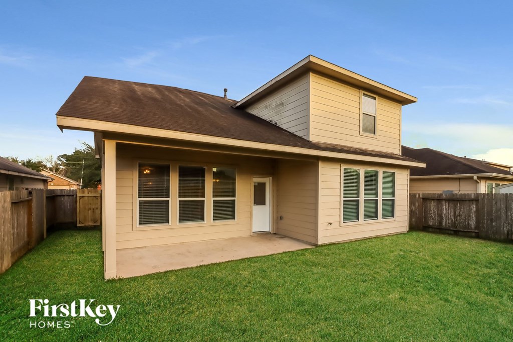 the exterior of a house with a lawn and a yard