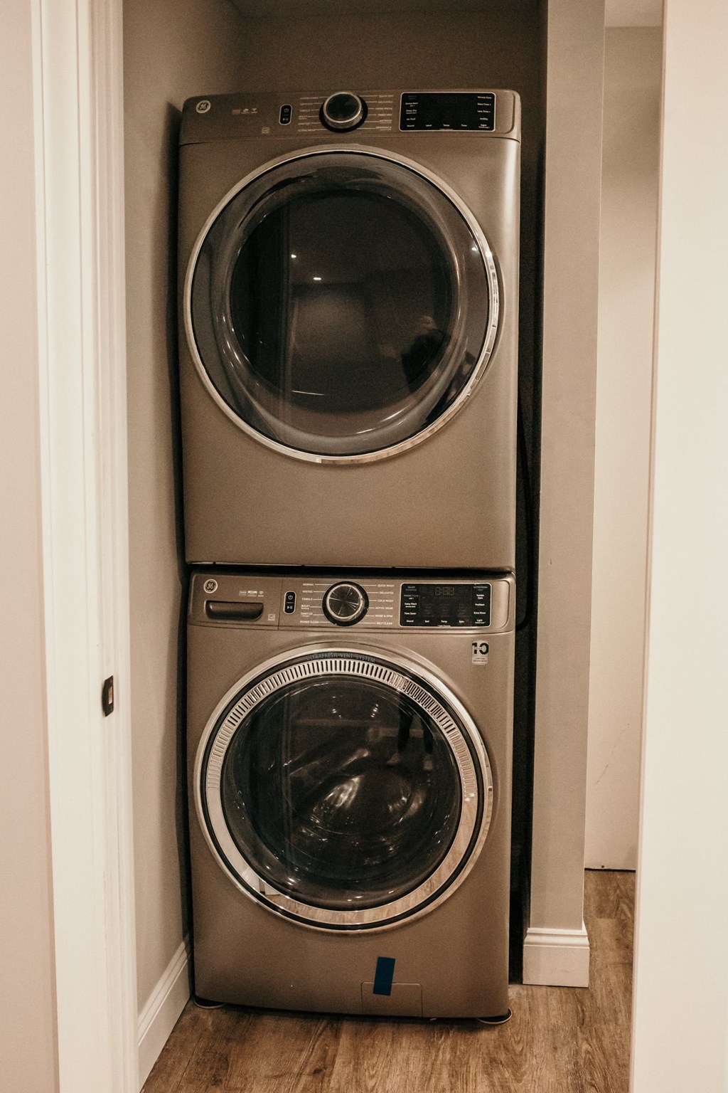 a front loading washer and dryer in a laundry room