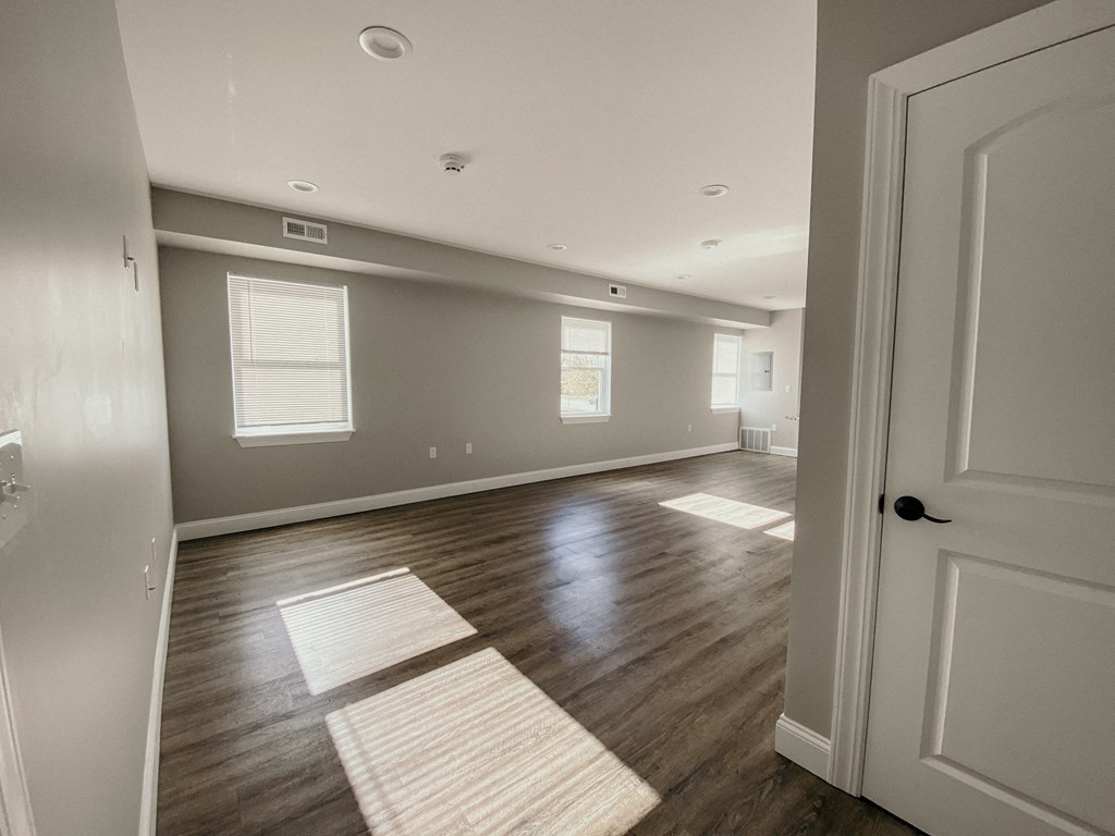the view of a living room from the door of an empty house