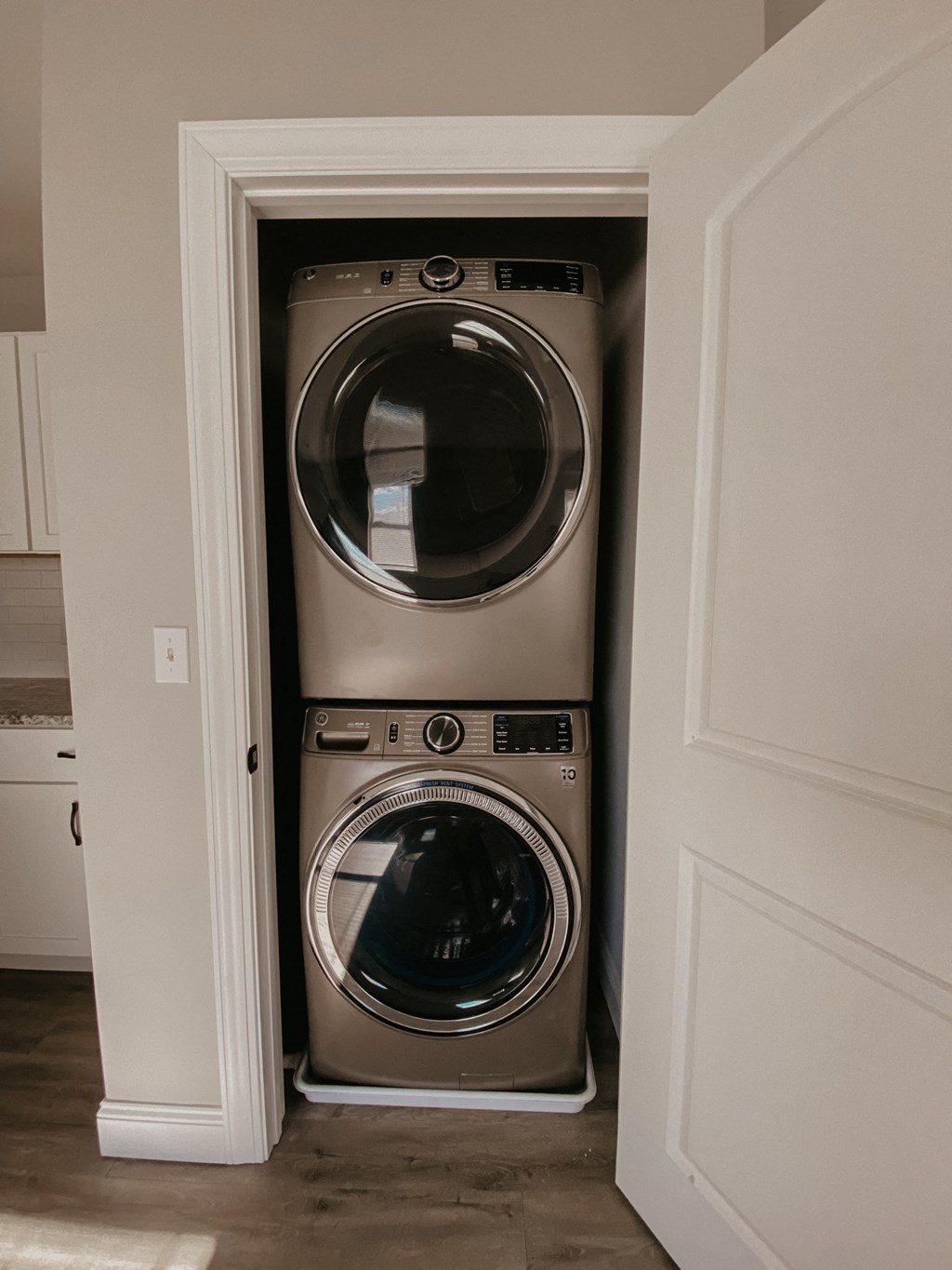 a front load washer and dryer in a laundry closet