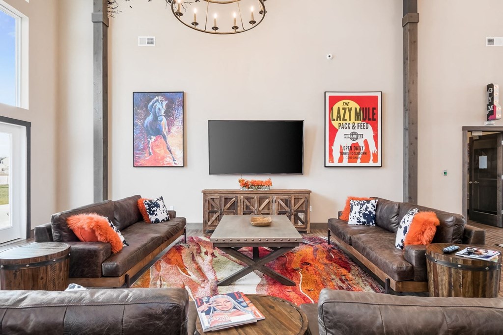 a living room with couches and a tv