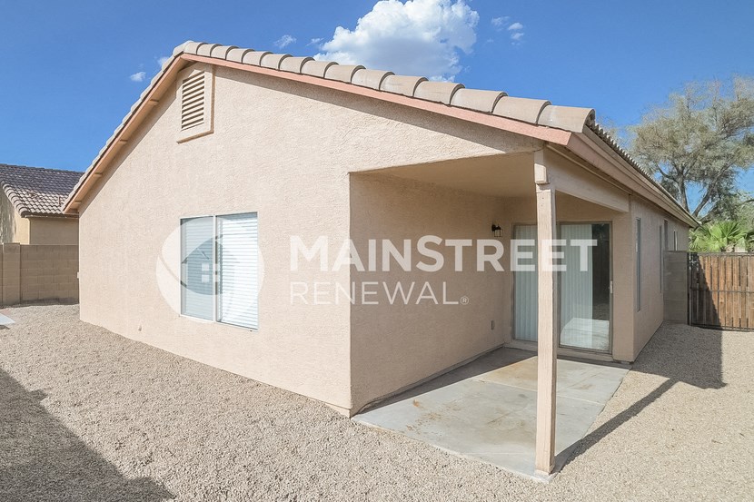 a small house with a garage and a window