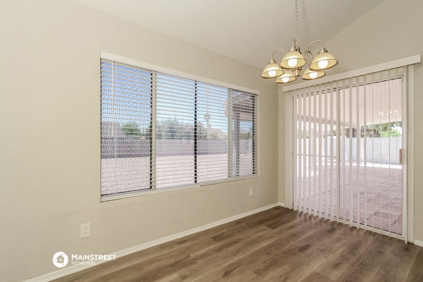 the living room of a new home with a large window