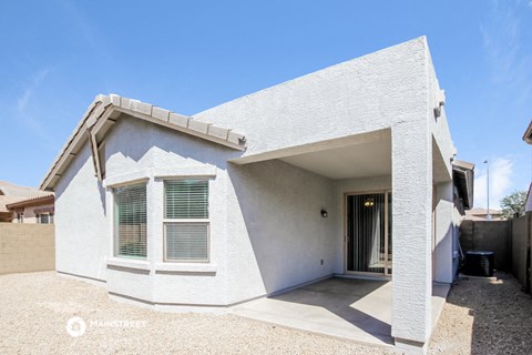a white house with a door and a window