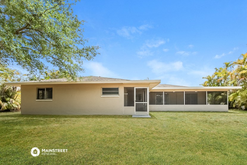 a house with a lawn and a tree