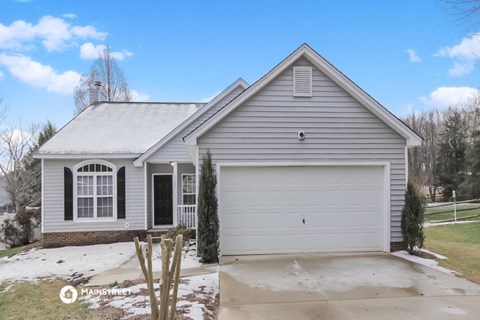 a white house with a white garage door