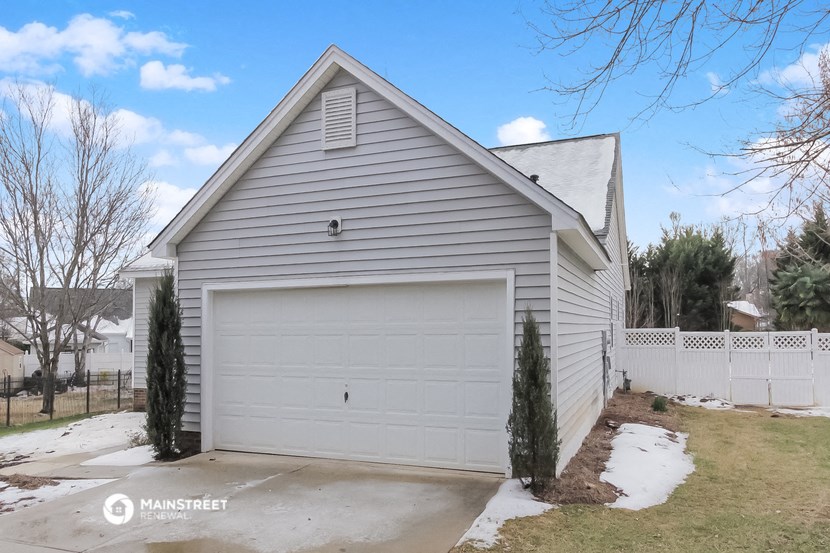 a white house with a white garage door