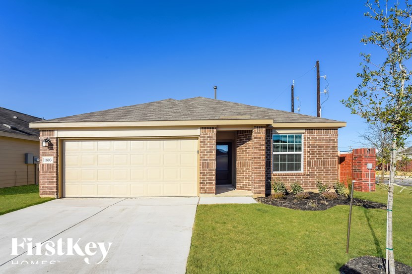A house with a garage door that says "FirstKey Homes".