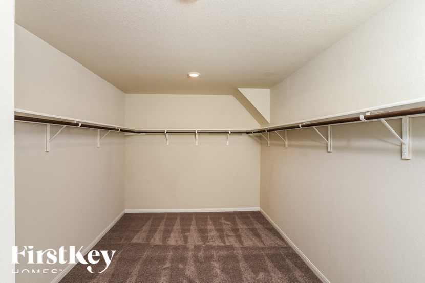 A room with a carpeted floor and white walls.